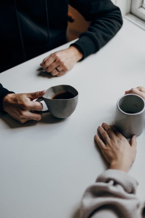 Image of two people having coffee